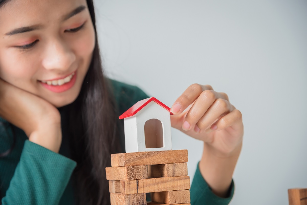 Young Asian Business Woman With Small House, Grow Up Business So